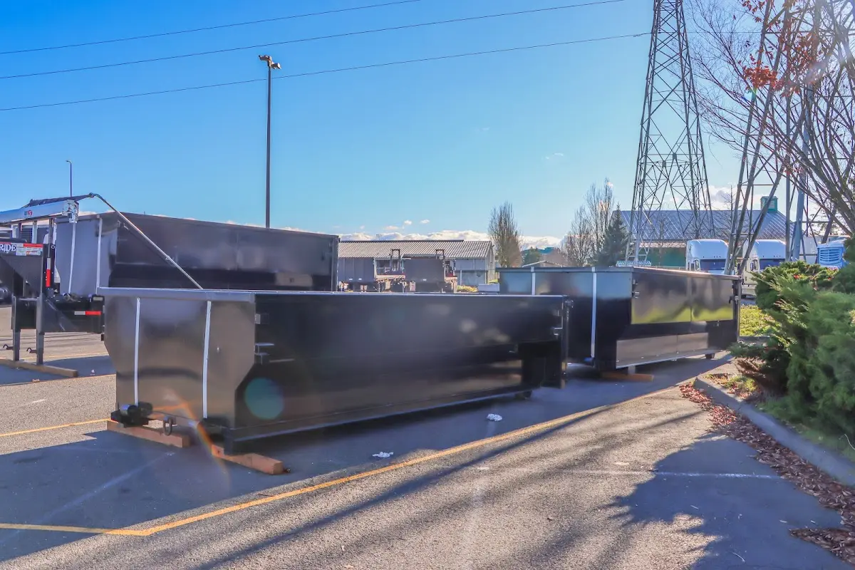 Roll-off dumpster ready for waste disposal at job site for Roofing Dumpster Rental in Rocky Mount